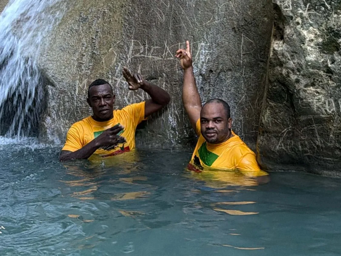 Two Lifestyle Hikers in the pool at the foot of Gutter Head Falls, St. Thomas