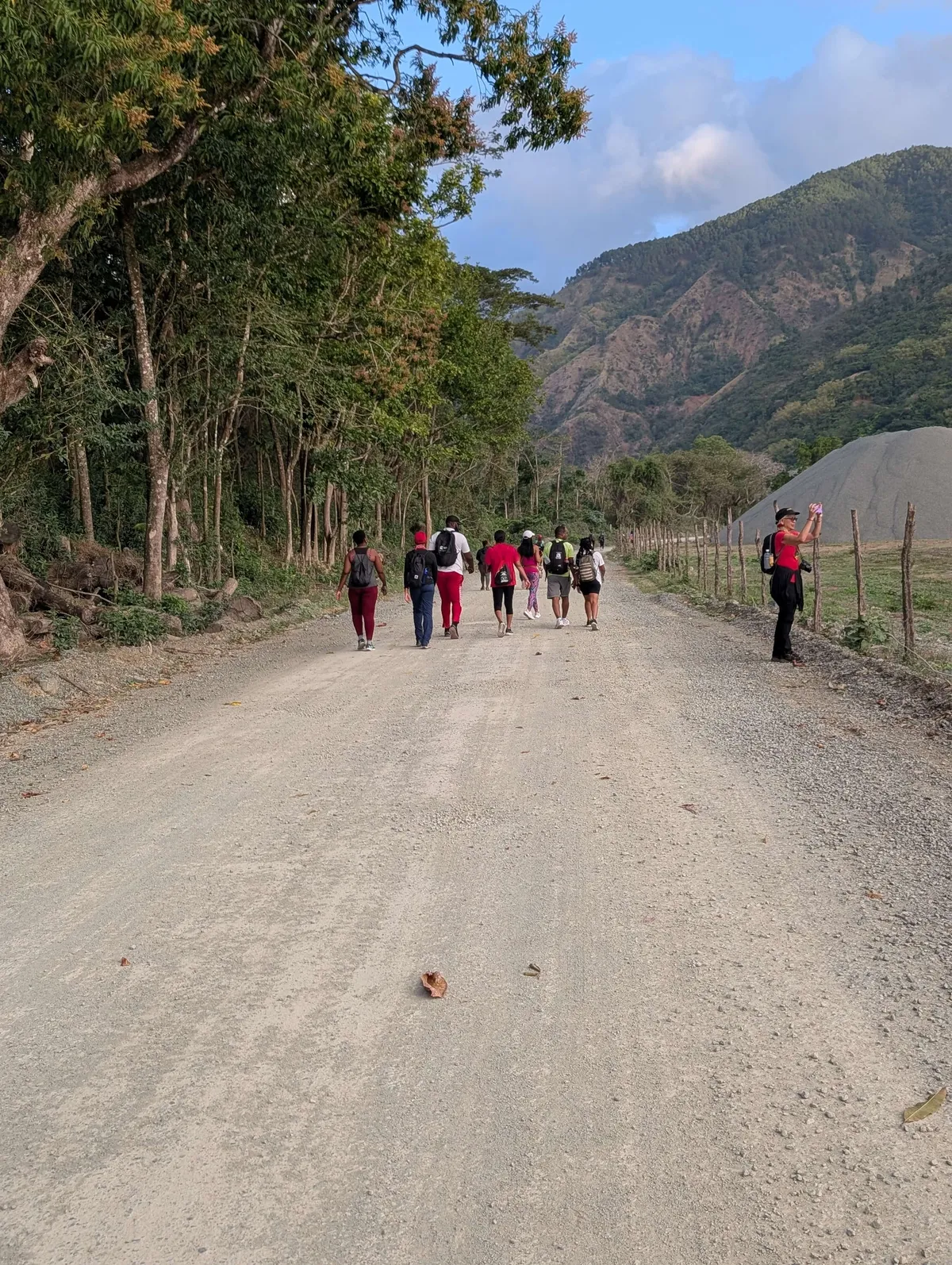 Lifestyle Hikers group pausing together on a Jamaica hillside trail